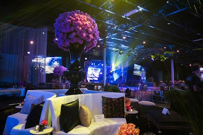 Multiple unique lounge groupings offered guests respite from the stage and dance floor. Oversize floral arrangements matching the step-and-repeat installation adorned the vignettes and added to the immersive experience of the event that Kehoe sought to deliver.