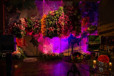 In lieu of a traditional step-and-repeat, Kehoe designed a large floral sculpture supported by three wire framing panels; a hand-painted mural served as the backdrop. Elsewhere, Kehoe utilized the models and greeters as an additional branding opportunity with temporary tattoos on their bodies.