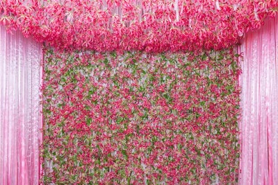 When it came to her own engagement party, Toronto-based floral designer Michelle Tran of With a Flower sought to create a secret garden within a suite at the Ritz-Carlton, Toronto on July 18. Birch trees adorned the corners of the room with roses and gloriosa lilies on tables, suspended from the ceiling, and incorporated into the chandeliers. The installation of the 25,000 gloriosas and 2,000 pink floyd roses took nearly four days.