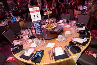 Hargrove paid additional attention to the details on the ringside tables, including specialty linens, individual gift boxes, custom menu cards, and illuminated centerpieces of iconic photos of Ali.