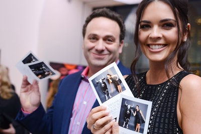 At the photo booth, guests including Katie Lee posed in front of a green screen and selected a barnyard animal to include in the image. Creative guests figured out how to pose to appear to be interacting with the animal, giving it a hug or kiss.