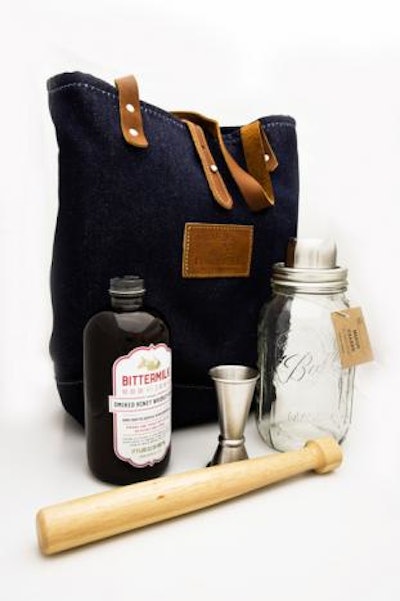 Cocktail mixer brand Bittermilk offers a gift set called the Overnighter, $125. The handcrafted denim cocktail tote is stocked with a Mason jar shaker, a muddler, a jigger, and a hand-made cocktail mixer in a flavor of choice. Options include “Smoked Honey Whiskey Sour” and “Charred Grapefruit Tonic with Bulls Bay Sea Salt.” Products ship throughout the United States and Canada.