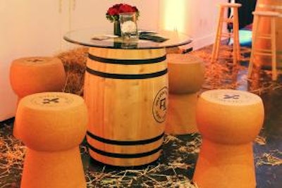 A wine barrel accompanied by cork stool ottomans from the Cork & Rustic Collection.