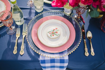 Specialty linen rental company House of Hough includes edible elements at its table settings for a personalized touch. The decorative details may be cookies, fruit, or other foods. Owner Clara Hough commented on the setting (pictured), saying 'without the cookie, this setting is pretty ordinary, but including one on each plate makes a huge impression.'