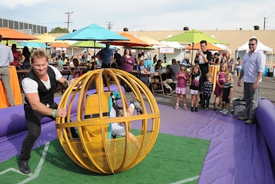 A human bowling activity—in which guests tried to knock over oversize pins from within a caged ball—was among the crowd favorites at the Elizabeth Glaser Pediatric AIDS Foundation's A Time for Heroes family festival.