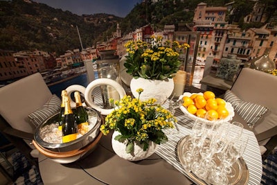 A bowl of oranges and a bucket of chilling champagne decorated a tabletop inspired by Portofino, Italy. The table was sponsored by the Design Center at the Merchandise Mart and designed by Tom Stringer Design Partners.
