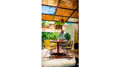 The tropical outdoor patio at KLIMA Restaurant and Bar