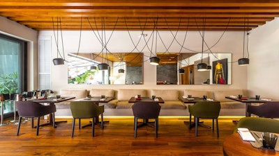 A spacious and sophisticated dining room at KLIMA Restaurant and Bar