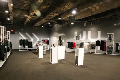 Post-show, guests lined up to enter the Balmain for H&M pop-up shop that had been erected in the basement of 23 Wall Street. While the upstairs had been completely made over, the pop-up space remained largely raw.