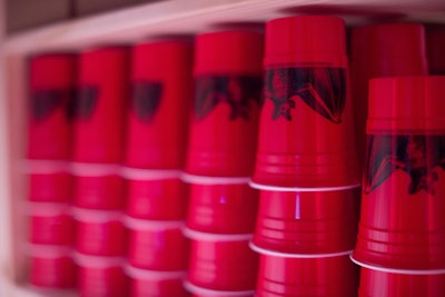Inspired by the red cup house party staple, drinks are served out of red cups with the brand's logo.