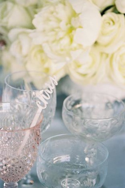 For a wedding coordinated by Jacin Fitzgerald Events in Napa, California, Dallas-based Southern Fried Paper laser cut place card drink stirrers out of blush marbled acrylic for a creative personal touch. The tabletop decor element is available for corporate, nonprofit, and social events. Pricing varies depending on material and lettering style, but generally costs $650 for 100 guest names.