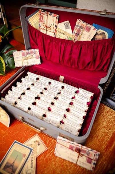 For a wedding at Union Station in Los Angeles, Sterling Engagements displayed escort cards printed to look like train tickets inside vintage suitcases.