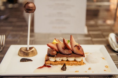 A three-course dinner at the gala included foie gras torchon, Waygu beef, and purple potatoes with truffle sauce. The dessert (pictured) was a wine-poached pear-and-fig Napoleon with gingerbread gelato and a honey-chocolate truffle.