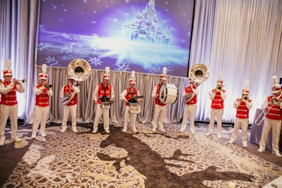 The 14-piece Main Street Philharmonic Marching Band also appeared in the Four Seasons' ballroom as part of the surprise announcement. Planners worked with the teams from Disney's Fairy Tale Weddings and Disney Entertainment Group to plan the surprise entertainment, which also included a 'boy band tribute' from the Main Street Dapper Dan Barbershop Quartet.