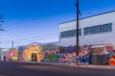 The debut took place in a graffiti-covered warehouse in downtown Los Angeles, with an exterior that did not betray the activities inside.