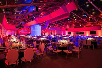 RG partnered with Stereobot to create four 180-foot-long curved ceiling structures that evoked the look of the museum's ribbon-like facade. Lighting in the Petersen's signature red color gave the party space a dramatic look.