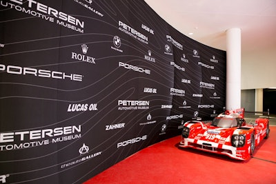 The step-and-repeat wall at the entrance to the gala had a look that mirrored the look of the museum with a curving wall that also suggested motion.