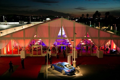 Presenting sponsor Porsche, as well as Maserati, BMW Beverly Hills, and Hyundai, were among the roster of event sponsors. A vehicle from Porsche stood sentry outside the dinner tent, bathed in focused light reminiscent of an elegant auto show display.