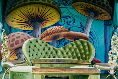 One of the lounge settings was inspired by the Caterpillar character, with silky green seating and oversize images of mushrooms.