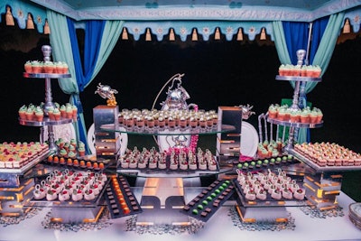 One of the tents had a lavish spread of sweets. Whimsical snacks included daisy-shaped cupcakes in terra-cotta pots and 'Forest Berry' cheesecake.