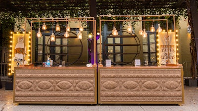 Wow guests with the striking Parlor bar and canopy featuring a copper frame and ornate studded patterns.