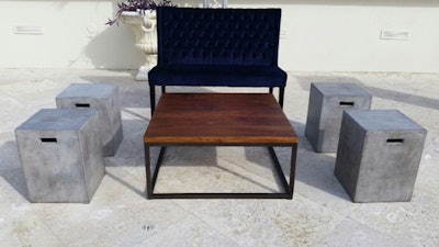 Midnight banquette with chestnut coffee table and flat iron end tables/stools.