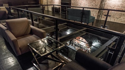 The lounge overlooking the main bar at Brick & Mortar, which can be rented separately.