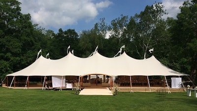 A custom Sperry arch welcomes guests