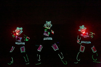 A trio of iLuminate dancers in L.E.D. suits performed at Alienware's laptop launch during the Electronic Entertainment Expo in June 2013 in downtown Los Angeles.