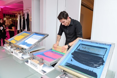 A silks-creening station let guests customize versions of one of Stefani’s signature looks: a cutoff T-shift with Old English lettering. Guests could choose from two colors of T-shirts and four colors for the print, which featured the collection logo.