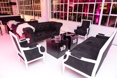 Black and white furniture rentals mixed Louis XV-style chairs and sofas with modern tables.