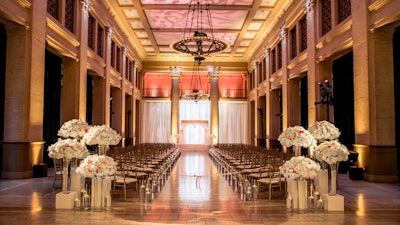 Beautiful lighting and a floral arrangement in the Banking Hall.