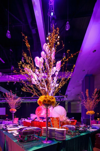 Oversize candy props and towering florals decorated buffet stations.