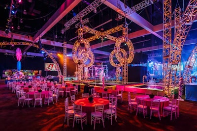 About 5,000 guests filled the massive party space the size of three football fields. Illuminated trussing served as decor surrounding a central water feature within the space.