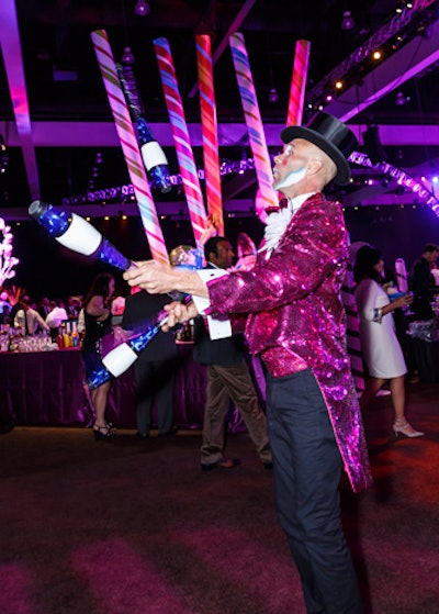 An array of roving performers including a costumed juggler entertained guests throughout the cavernous convention center party space.