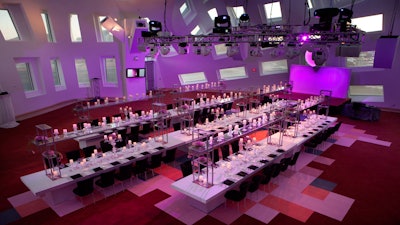 Multi-tiered candlelit tables at the Keep Memory Alive Event Center