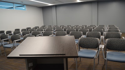 A classroom with a podium at the Victoria College Conference & Education Center.