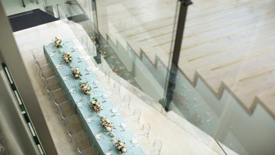 A view from above of a private dinner reception in the Galleria Lower Level