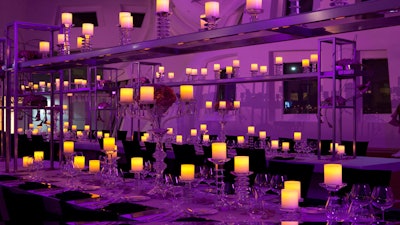 A candlelit table setting at the Keep Memory Alive Event Center