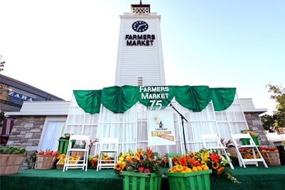 When Los Angeles’s Farmers Market first opened in 1934, local farmers casually sold their goods from vehicles parked on the otherwise empty land. To celebrate the market’s 75th anniversary in 2009—by which time the Mid-City area of Los Angeles had become an intensely high-traffic center—a milestone-marking event included a stage decorated with colorful produce in baskets.