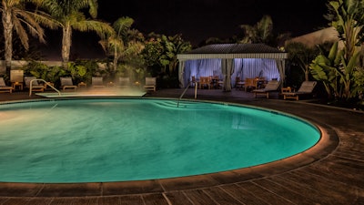 Heated plunge pool and Jacuzzi with poolside cabanas.