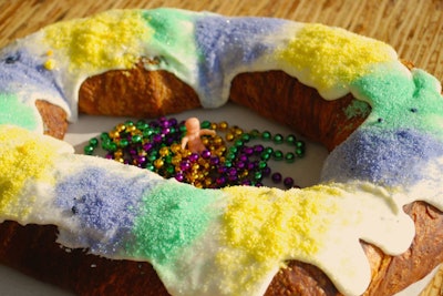 In Washington, Bayou Bakery, Coffee Bar, & Eatery offers 'Mardi Gras in a Box.' The order contains a king cake that serves 12 to 14, as well as traditional beads, a king-cake history card, and a baby figurine baked inside.