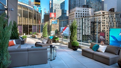 Broadway Lounge Outdoor Terrace, Facing North: Find your comfortable perch 8 stories above the bright lights of Times Square at one of our cocktail tables and enjoy selections from our outdoor menu .