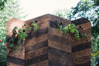Last summer, Ruie & Grace participated in the Big Fake Wedding, a bridal show held in Baltimore that featured a vow renewal. The duo created the ceremony's backdrop, which was a wooden folding wall decorated with metal can planters.