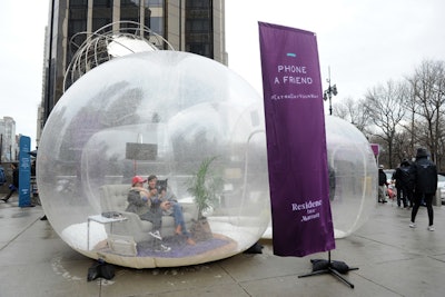 In a 'calling pod,' outfitted with a plush seating area and a phone, guests could call friends and family members.