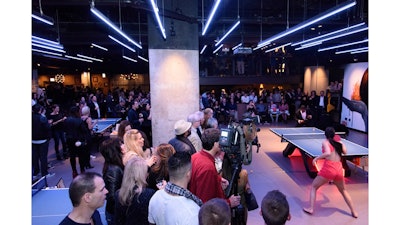 Table tennis pro Malin Pettersson battles it out on the main floor at SPiN Chicago’s grand opening party.