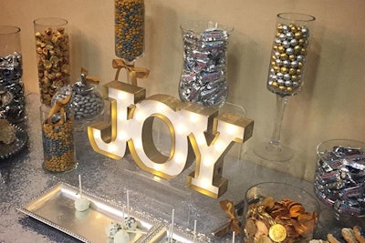 At an in-office preview for its clients' wares during the holidays in 2015, Los Angeles-based PR agency BWR offered a metallic dessert bar decorated with the word “Joy” in marquee-style letters.