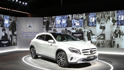 An urban street was created to promote the Mercedes-Benz GLA at Fashion Week, which included a concrete-like floor, wheat-pasted posters, and multimedia.