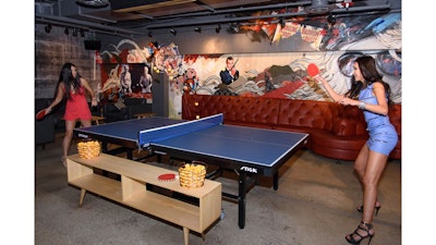 Table tennis pros Malin Pettersson and Soo Yeon Lee warm up at SPiN Chicago’s grand opening party.