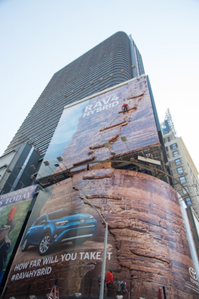 Professional rock climbers continuously scaled the billboard over the three-day period. The vertical climb measured 120 feet and took about 10 to 15 minutes for the pros to scale and 25 minutes for a certified amateur climber to scale.